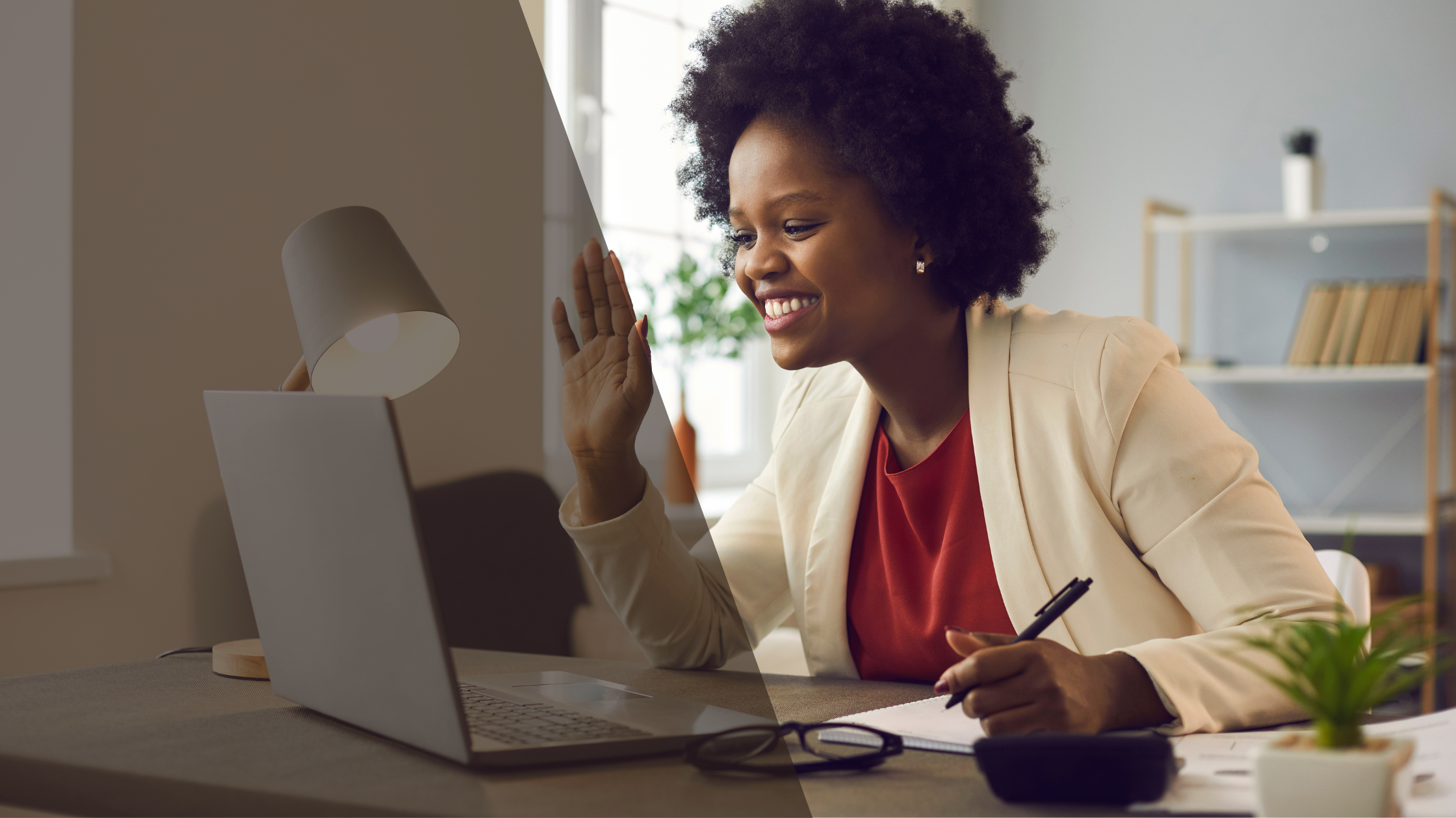 Woman waving to someone on laptop