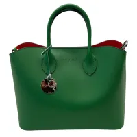 Mira Estell - (Pictured: Green Handbag)