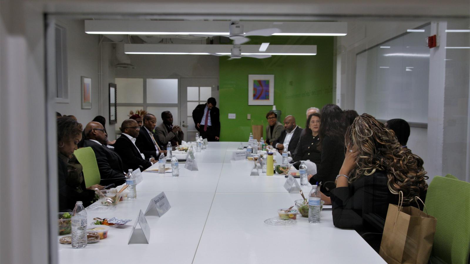 Full roundtable group through window