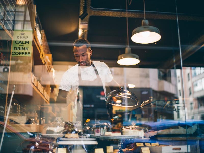 African American Man Chef in Restaurant Window